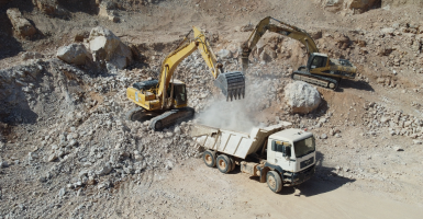 Mining site with trucks and machinery